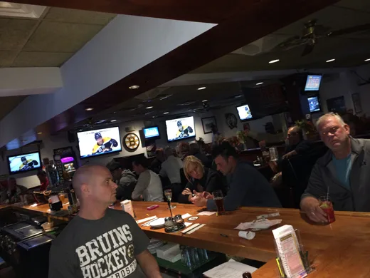 Bar seating with game day TVs at Alumni Sports Cafe