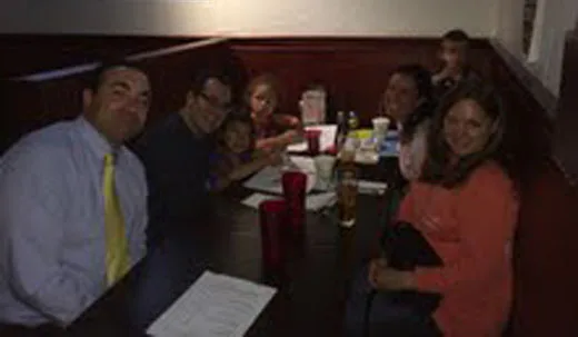 Group celebrating at a booth